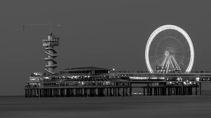 Scheveningen Pier and ferris wheel at night, black and white