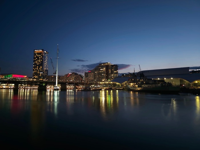 Darling Harbour Sydney skyline at night, reflected in water